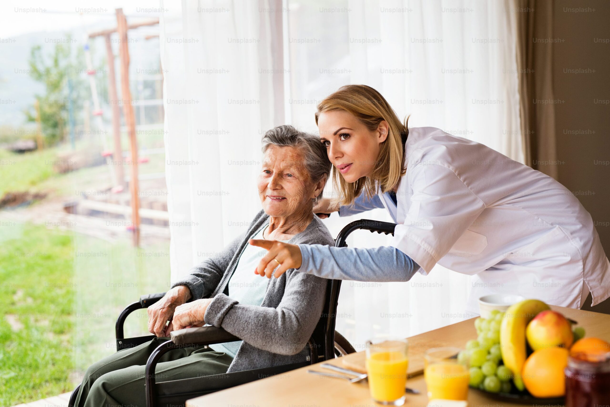 Caregiver supporting an elderly client during Thanksgiving, expressing gratitude and connection.