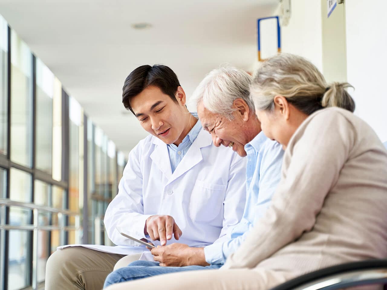 Caregiver organizing medications and assisting senior with daily medication routine.