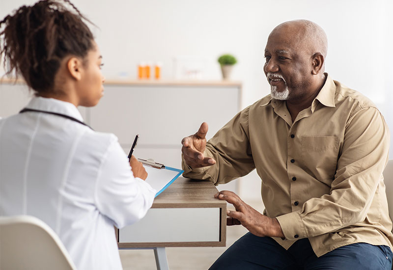 Caregiver assisting senior with daily activities at home, promoting dignity and respect